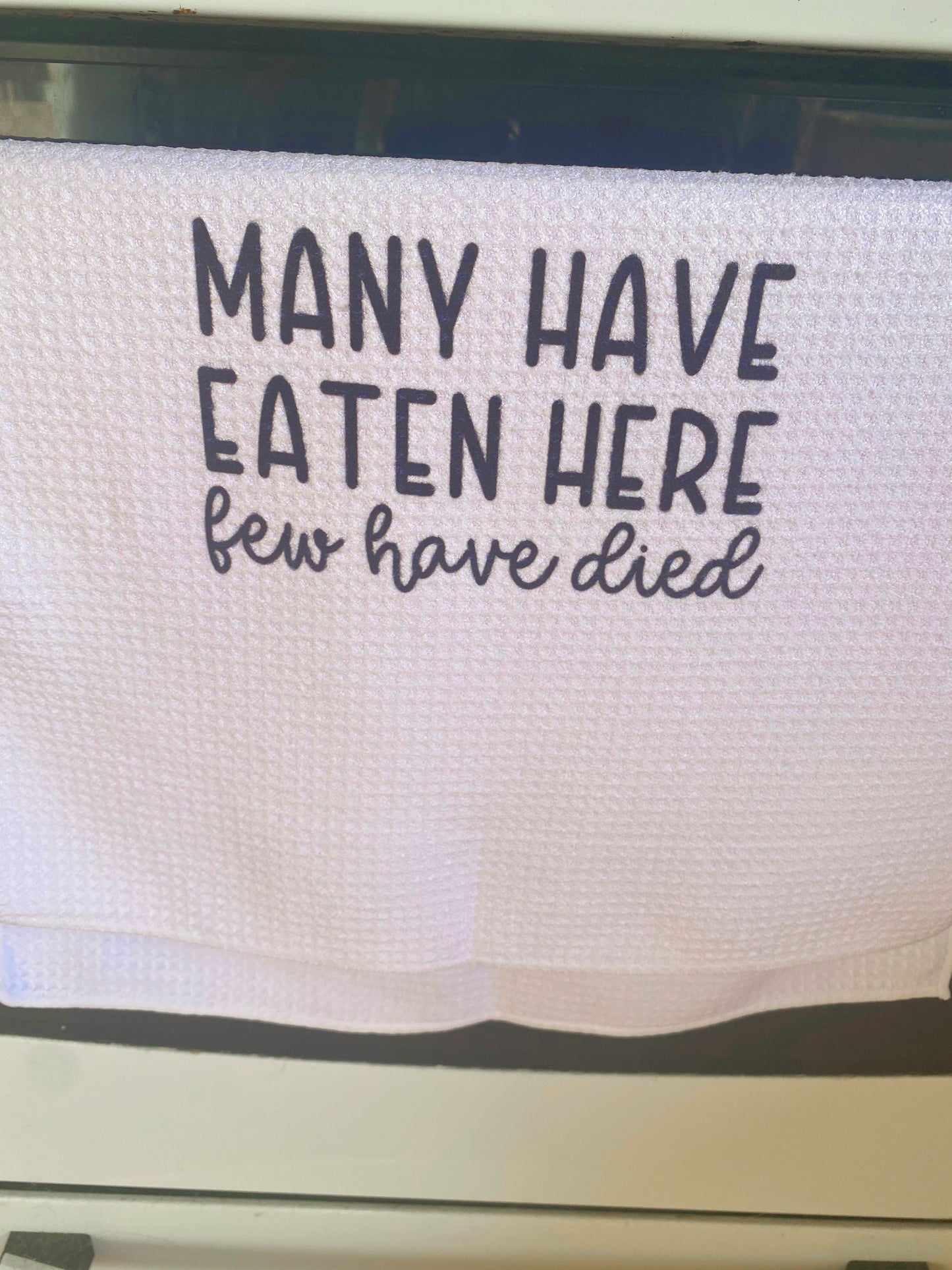 Many have eaten here few have died tea towel